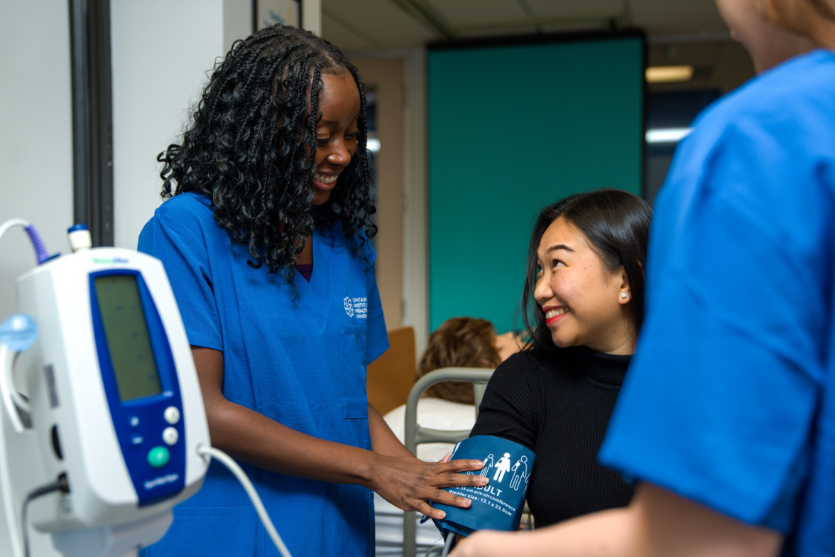 Nurse taking patient blood pressure